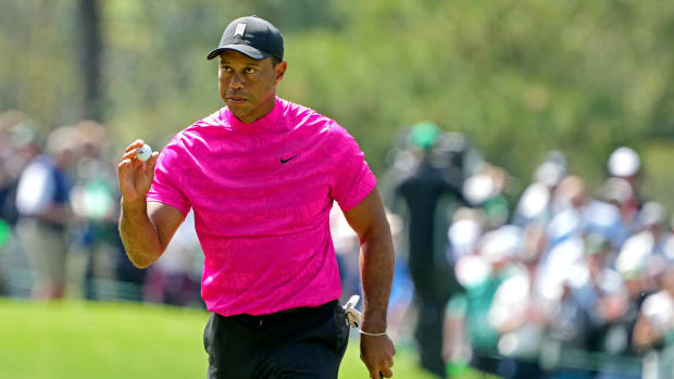 Tiger Woods reacts to his putt at The Masters golf tournament.